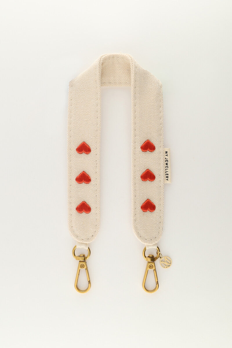 Beige phone lanyard with red hearts